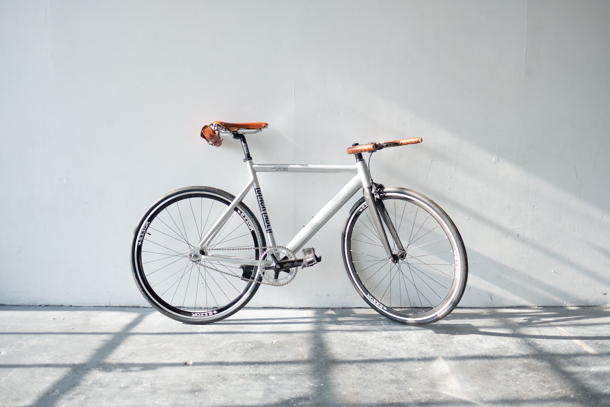 Bicycle resting against a pale wall on Short Street